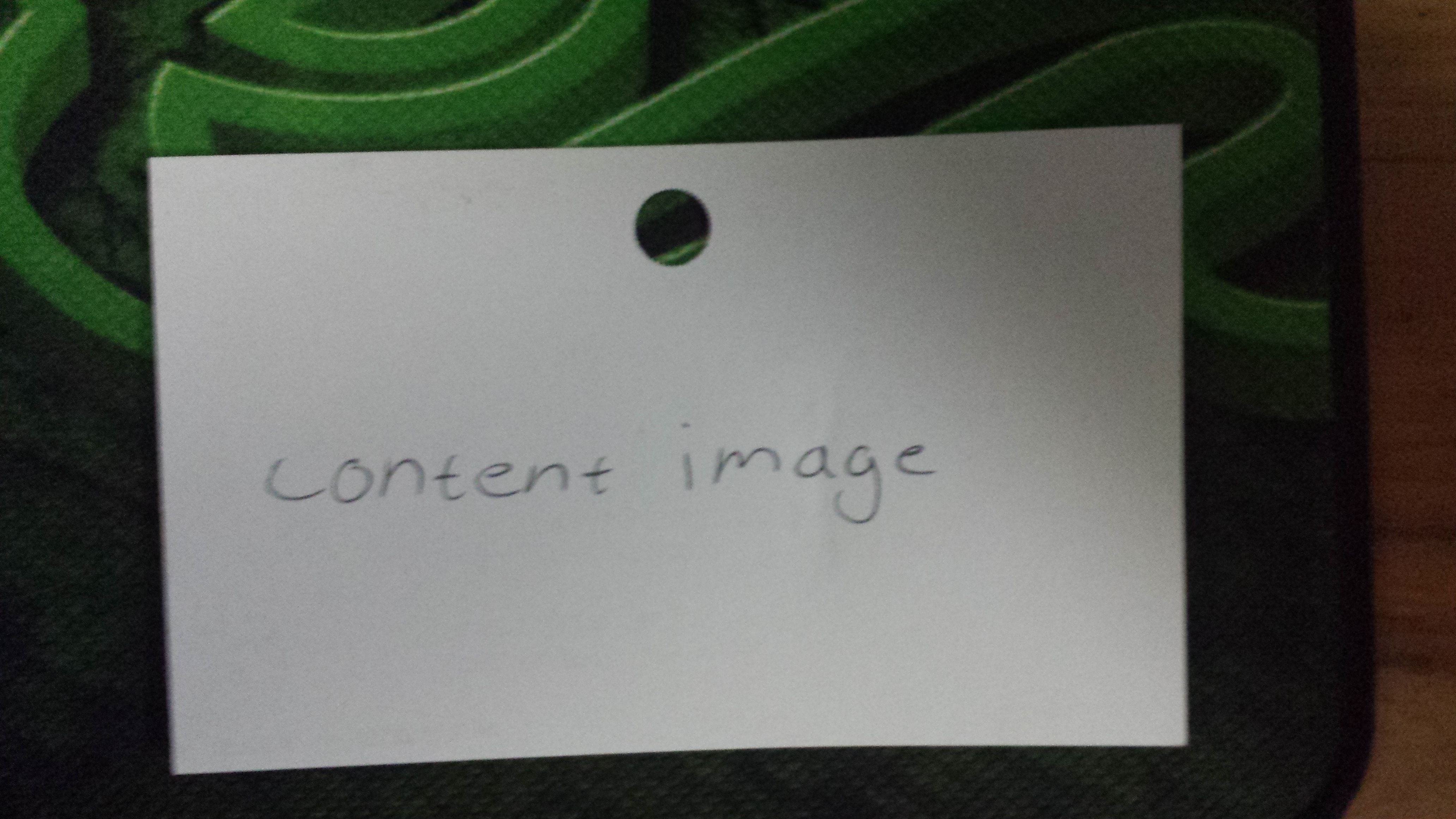 A small piece of paper with content image written on it.